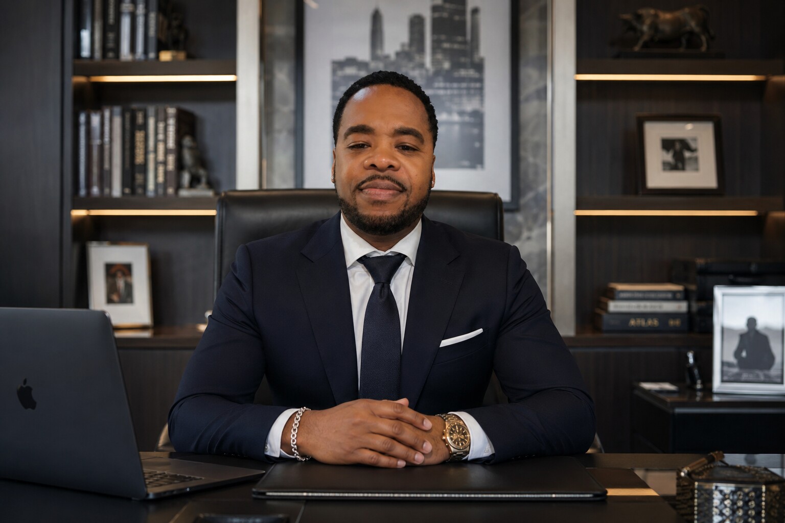 Jeremiah Matador seated at a desk in his office